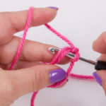 Insert the crochet hook into the ring from above...