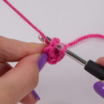 To close the ring, pierce the first single crochet (UK: double crochet) and pull through the thread.