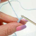 ...get the thread for the first chain stitch through the loop