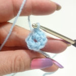 ...until there are 7 single crochet (UK: doppel crochet) in the ring.